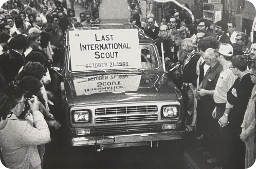 A family with their pickup truck in the mountains